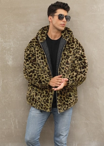 Detailed macro view of the warm black diamond quilted lining inside the leopard faux fur jacket