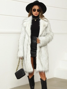 Long faux fox fur coat for women in off-white with black tips and urban styling