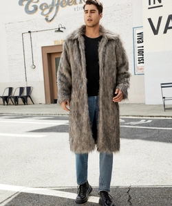 Outdoor street style shot of man wearing a long grey faux fur coat with large collar