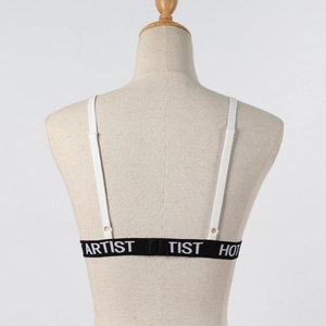 Detail view of white sports bra back featuring adjustable straps and hot artist logo band