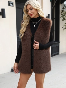 Close-up of the fluffy texture and long fur detail on this brown faux fur vest for women