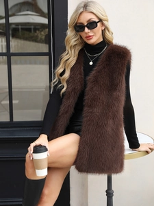 Detail of premium dark brown faux fox fur vest showing dense texture and long fibers