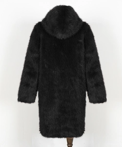 Back view detail of black long-sleeved hooded coat with thick plush faux fur texture