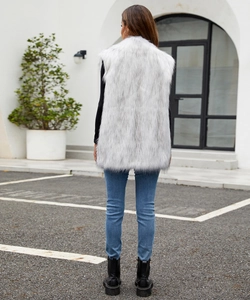 Detail view of the back texture of a fluffy long-haired white faux fur vest for women