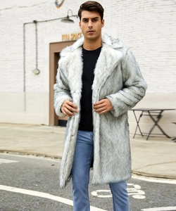 Outdoor street style shot of a men's light grey faux fur overcoat with a black notch lapel