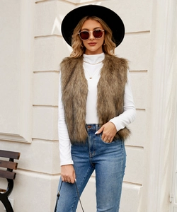 Detail of dark brown faux fur vest texture showing long hair fibers and open front design