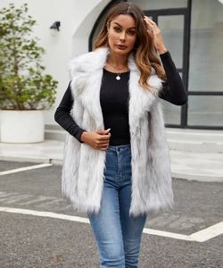 Detail of light grey faux fox fur long vest with soft plush texture and sleeveless design