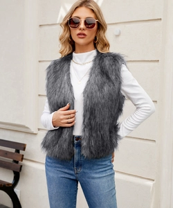Close-up of gray faux fur vest featuring long plush texture and sleeveless open design