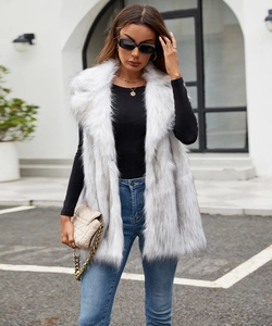 Close-up of faux fox fur vest texture with cream and grey gradient on a long waistcoat