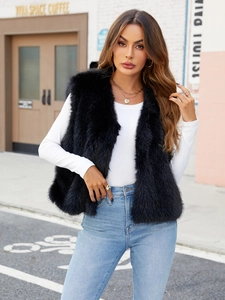 Women's trendy black faux fur vest with V-neck sleeveless design and fluffy texture