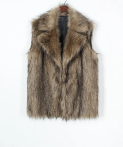 Detail of faux fox fur vest showing gradient brown texture and large lapel collar