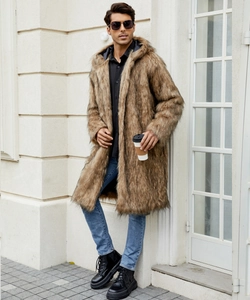 Outdoor street view of a man in a long brown faux fur hooded coat with plush texture
