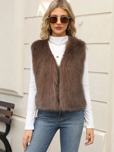 Detail view of the deep brown faux fur vest with soft fluffy texture and V-neckline