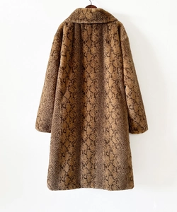 Detail view of the brown snake pattern faux fur lining on this long men's overcoat