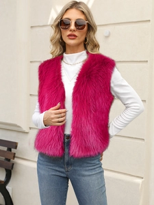 Detail of fluffy rose red faux fur vest showing plush texture and premium lining quality