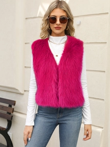 Detail view of vibrant pink faux fur vest with soft texture and stylish V-neck design