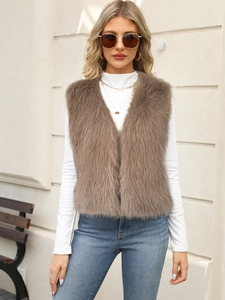 Detail of premium brown faux fur vest with a soft texture and elegant V-neck design
