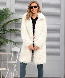 Close-up detail of plush white faux fur texture and lapel design on this winter coat