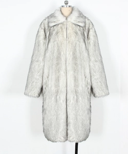 Detailed close-up showing the soft texture of a long faux fur coat with a large lapel collar