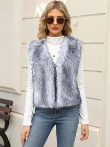 Detailed texture of fluffy grey faux fur vest showing layered plush and metallic sheen