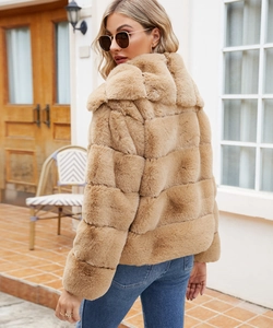 Detail of camel faux fur jacket showing square patchwork texture and large collar