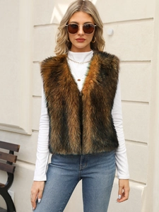 Close-up of fluffy faux fur vest in mixed brown tones with soft texture and open front
