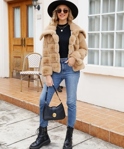 Full body street shot of camel faux fur jacket styled with black hat and combat boots