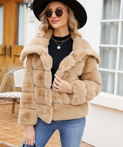Close-up of camel faux fur jacket with large lapel and square textured stitching detail