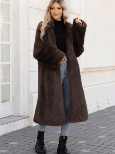 Luxurious long brown faux fox fur coat with a wide collar for winter warmth and style