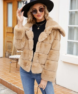 Detail of camel faux fur jacket showing thick patchwork texture and plush collar