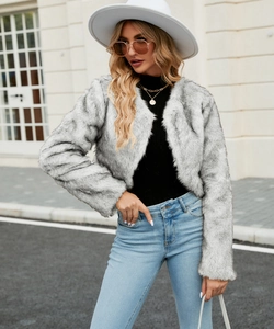 Detailed texture of gray faux fur jacket showing soft plush fibers and natural color patterns