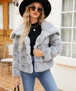 Detail of light grey faux fur jacket with horizontal stripe stitching and fluffy texture