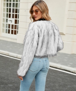 Detailed texture of white faux fur jacket with light grey stripes and fluffy material