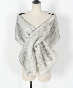 Detail of grey and white faux fur texture on a crossover bridal stole wrap for winter