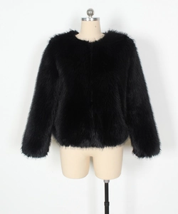 Close-up of premium black faux fur texture on a minimalist round neck short jacket