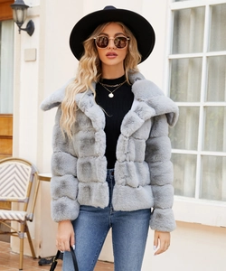 Detail of light grey faux fur jacket with segmented panels and wide collar design