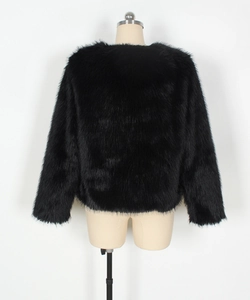 Rear view of black faux fur jacket showing plush texture on a mannequin torso