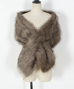 Close-up of thick brown faux fur shawl showing fluffy texture and crossed design