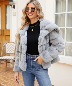 Detail of grey faux fur jacket with quilted texture and soft hood for women