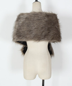 Detail of soft brownish-grey faux fur shawl with plush texture and smooth black lining