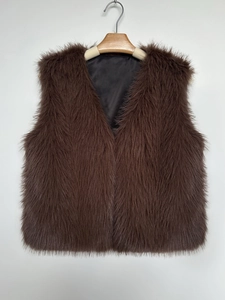 Detailed view of dark brown faux fur vest featuring a V-neck and smooth black lining