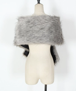 Detailed macro view of the fluffy grey faux fur texture and smooth black lining on the shawl