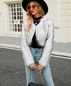 Close-up of black and white faux fur texture on a stylish short cropped jacket