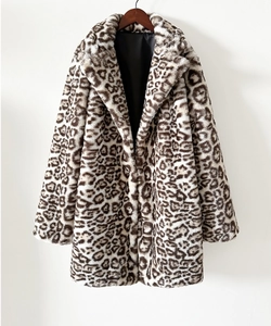 Close-up of leopard print faux fur coat featuring a wide lapel and soft plush texture
