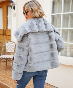 Detailed back view of a grey faux fur jacket with large lapel and striped texture