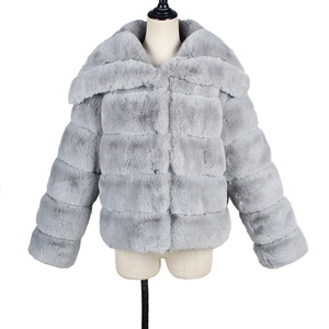 Detailed view of grey faux fur coat with horizontal striped texture and wide collar