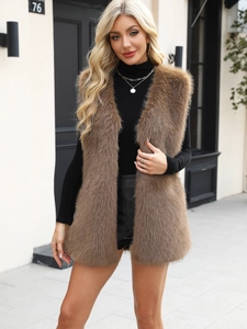 Close-up of brown faux fur vest featuring a luxurious plush texture for autumn fashion