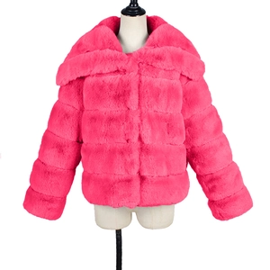 Close-up of bright pink faux fur coat featuring oversized lapels and horizontal stitching