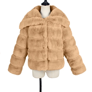 Detail of camel faux fur jacket showing wide lapel and horizontal stitched seam texture