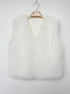 Detail view of white faux fur vest featuring a deep V-neck and plush long-hair texture
